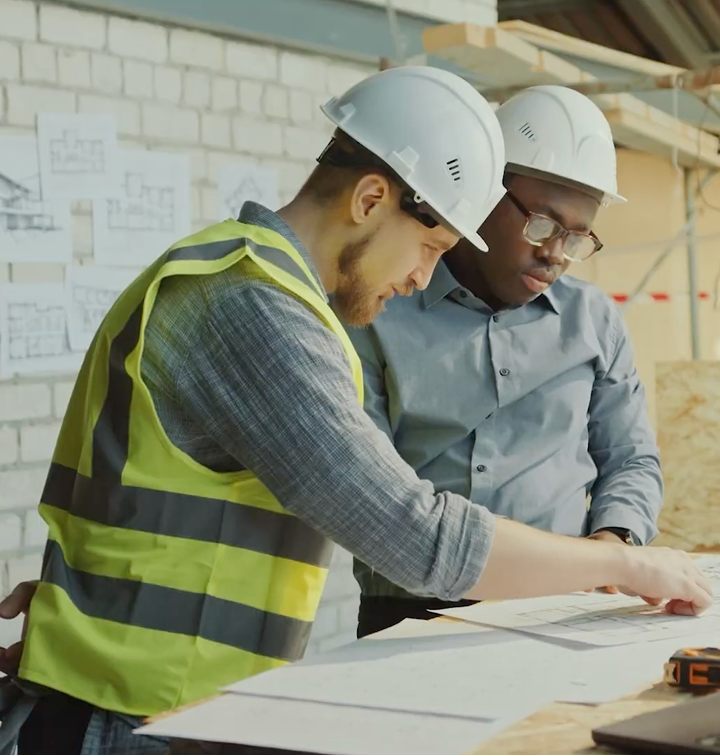 Construction professionals reviewing project plans